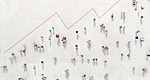 An overhead view of a crowd of people forms the shape of an ascending growth chart.