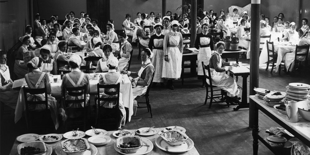 Nurses eating lunch in a hospital dining hall, 1920s