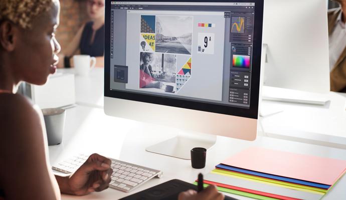 Creative professional working on digital graphics at a sleek workstation Creative professional working on digital graphics at a sleek workstation