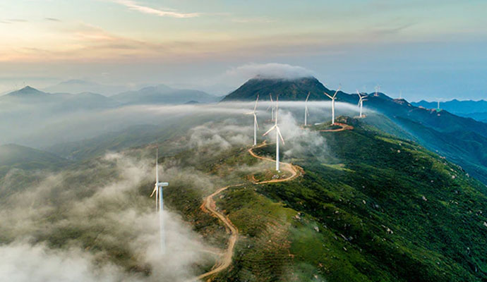 A photograph of a wind turbine farm.