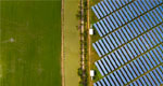 An aerial view of solar panels in a field.