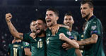 Members of the Italian national soccer team celebrate scoring a goal during a qualifying match for the UEFA European Championship.