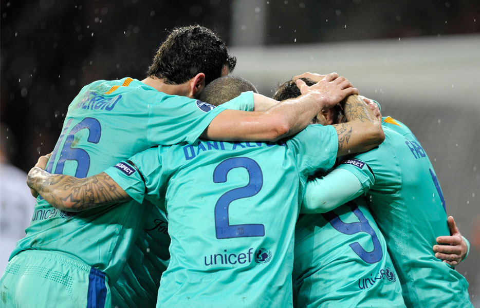 Barcelona players in a tight huddle as they celebrate a win during the 2012 UEFA Champions League