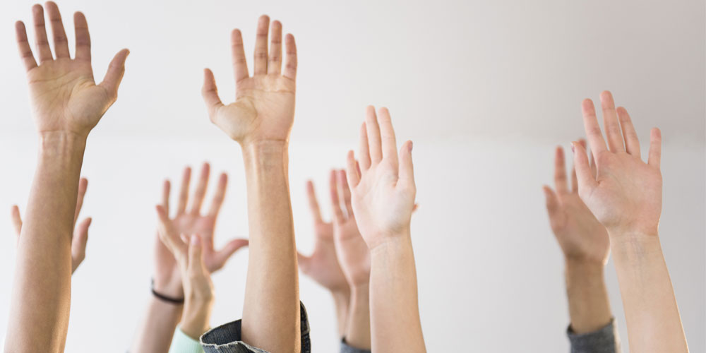 Stock photograph of raised hands Stock photograph of raised hands