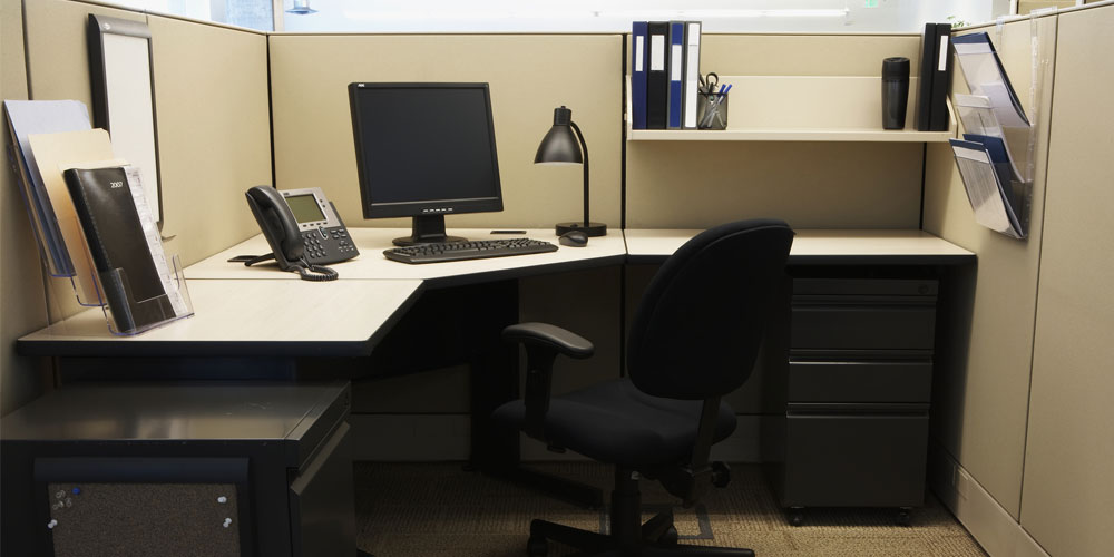 A photograph of an empty office cubicle A photograph of an empty office cubicle