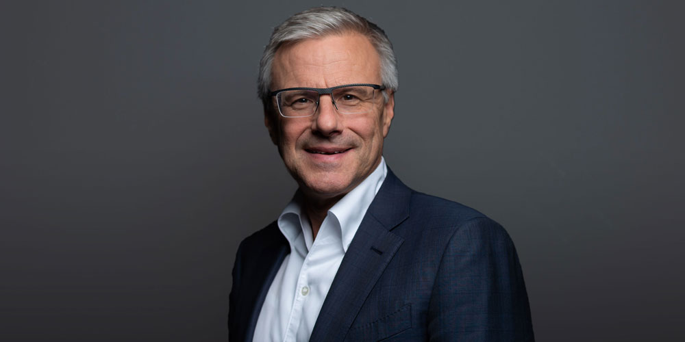 Photograph of Alain Dehaze, CEO of the Adecco Group.