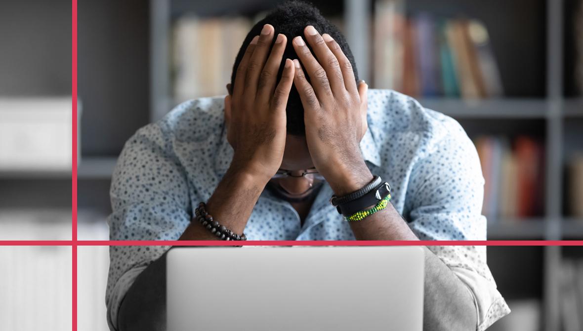 Stressed professional overwhelmed by work at a laptop Stressed professional overwhelmed by work at a laptop