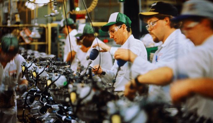 A photograph of workers on an assembly line