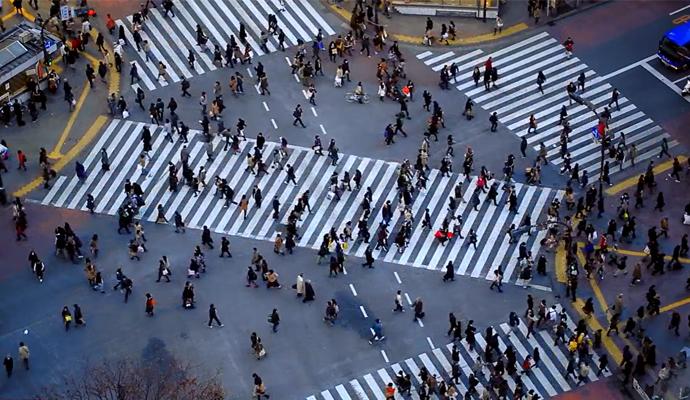 Pedestrians navigating a bustling urban crosswalk