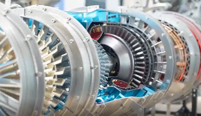 A partially exposed turbine reveals layers of metallic blades and brightly colored mechanical components.