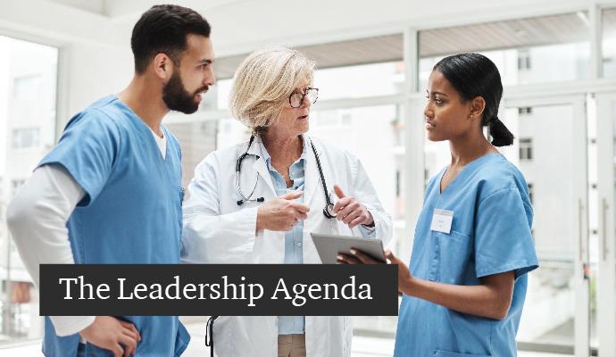 A photo of three medical professionals talking with the words "The Leadership Agenda" superimposed